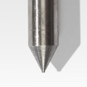 A close-up of the Tent & Wall Stakes, featuring a metallic pointed tip with a cylindrical shaft, casting a shadow on a light surface.