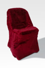 The Chair Covers, adorned in plush red fabric, stands elegantly against a light grey background, showcasing its sophisticated style.