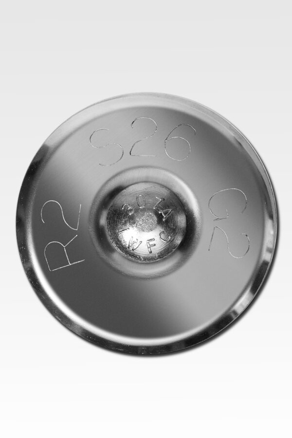 Close-up of a stainless steel disc showcasing engraved markings: "R2," "S26," "G2," and "LOT AF" - the distinct attributes of Stainless Steel Lot Markers.