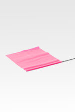 A pink "Grave Identification Flags" flutters gently on a thin metal pole against a stark grey background.