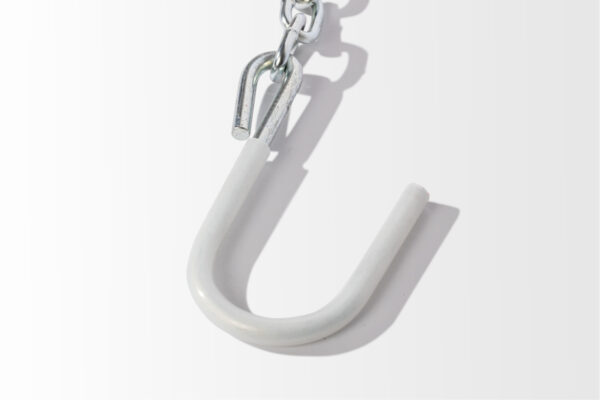 A Safety Chains white hook hangs elegantly against a simple background.