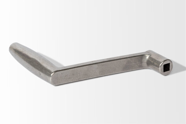 The Casket Crank, featuring a metal handle with a right-angle bend and a square socket end, rests on a light background.