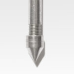 Close-up of a T Probe showcasing its metal nozzle, threaded shaft, and pointed tip against a plain white background.