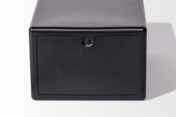 This black plastic Temporary Cremation Container, embossed with "Holland Supply Inc.," includes recycling symbols and "Made in the USA" text, highlighting its practical design and commitment to sustainability.