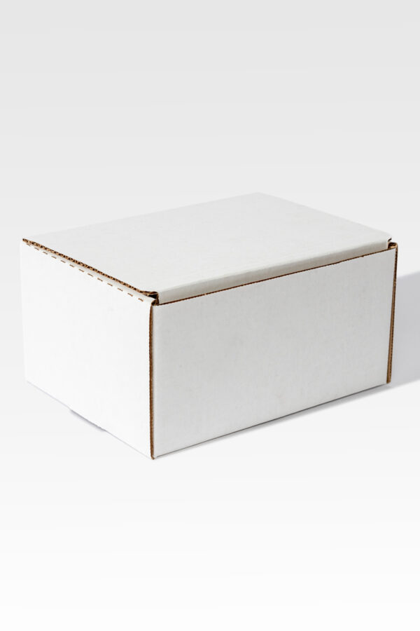 A Cardboard Mailer in a plain white rectangular design sits gracefully against a light gray backdrop.