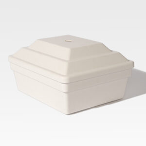 The Cremains Urn Vault, a beige rectangular tiered box with a small hole on top, is set against a plain white background.