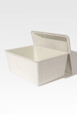 The Safeguard® Urn Vault, featuring a rectangular speckled design with a matching lid, stands open against a plain white background, evoking the image of a contemporary vault for treasured memories.