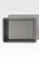 Rectangular gray metal baking pan on a light gray background.