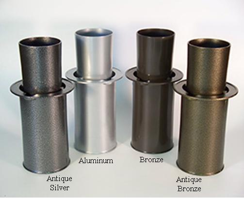 Four bestselling cemetery products, these metallic cylinder samples, come in different finishes: Antique Silver, Aluminum, Bronze, and Antique Bronze, all standing gracefully on a flat surface.