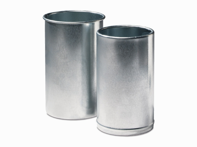 Two silver metal cylinders, reminiscent of a cemetery vase, stand upright on a pristine white background.